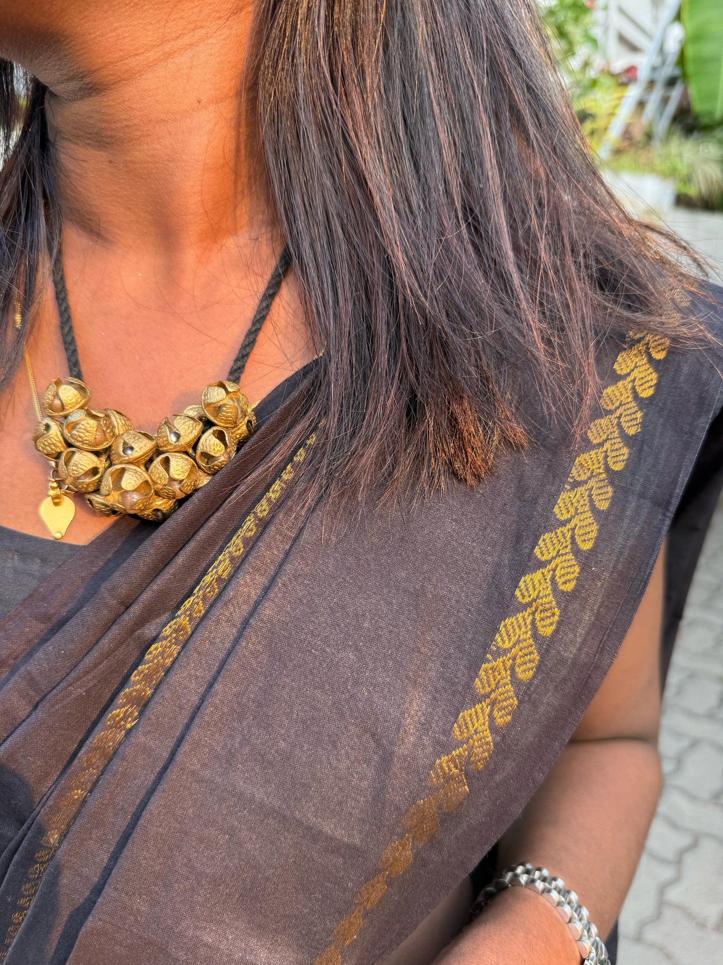 Sungudi cotton saree paired with chilanga jewels .