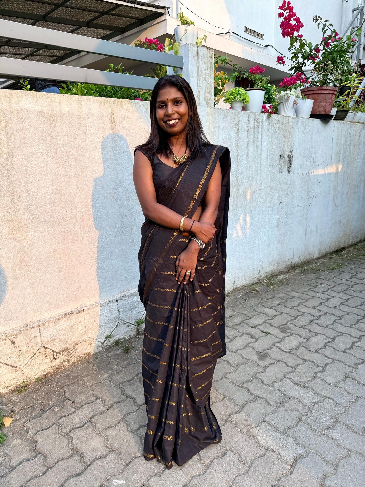 Sungudi cotton saree paired with chilanga jewels .